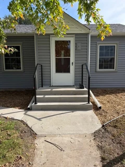 Project New Concrete Steps and Handrails Give This Front Entry a Fresh Look image