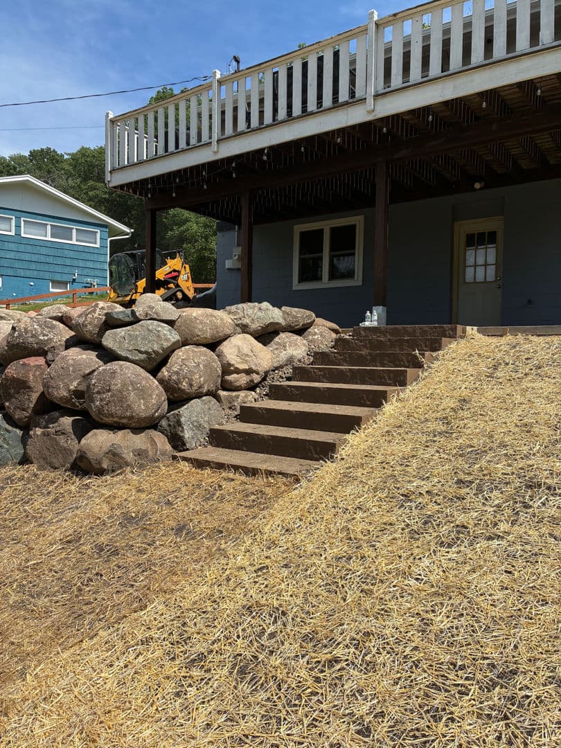 Boulder Wall and Steps That Tame a Tough Slope image